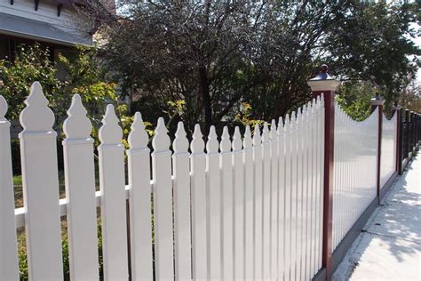 white metal picket fence